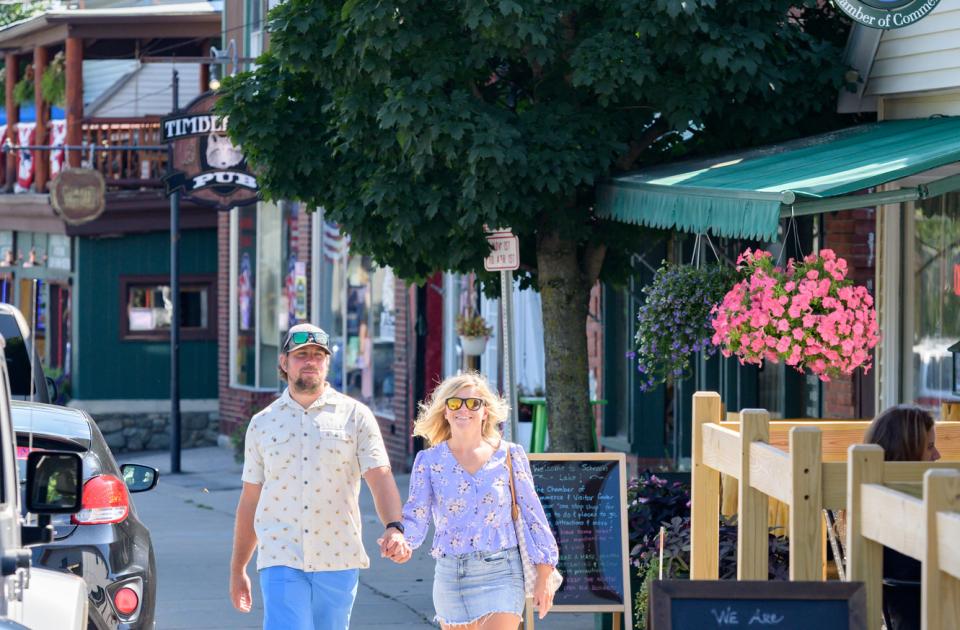 two people walking down main st
