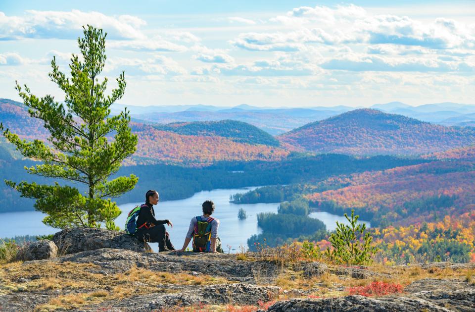 a couple looking out at Treadway Mountain